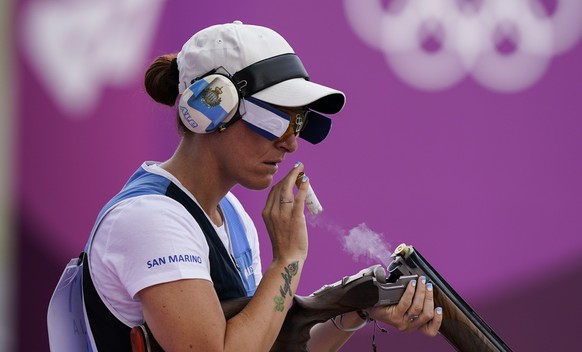 Alessandra Perilli, of San Marino, ejects her shells as she competes in the women&#039;s trap at the Asaka Shooting Range in the 2020 Summer Olympics, Thursday, July 29, 2021, in Tokyo, Japan. (AP Pho ...