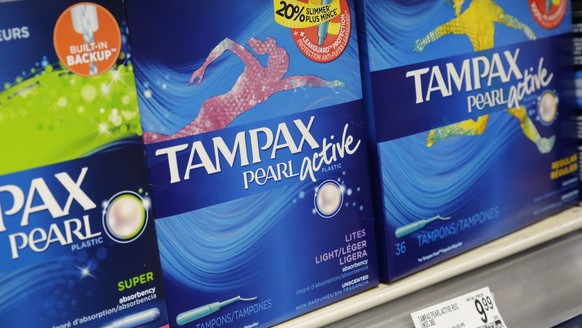 Boxes of tampons are displayed in a pharmacy, Monday, March 7, 2016, in New York. A group of women has filed a lawsuit accusing New York of unlawfully taxing tampons and other feminine hygiene product ...