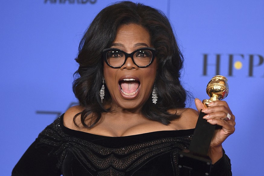 FILE - In this Sunday, Jan. 7, 2018 file photo, Oprah Winfrey poses in the press room with the Cecil B. DeMille Award at the 75th annual Golden Globe Awards in Beverly Hills, Calif. On Friday, Jan. 19 ...