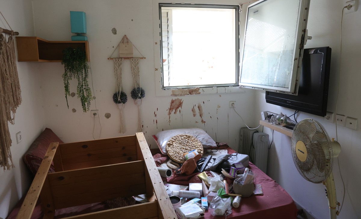 epa10920409 Blood is seen on the walls of a room inside the Kfar Aza Kibbutz, Israel 15 October 2023. The Kibbutz was the scene of an Hamas attack on 7 October which resulted in the deaths of dozens o ...