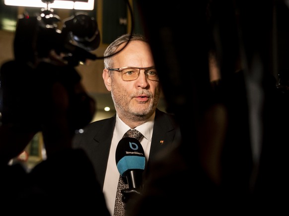 Eric Bertinat, Geneva politician of the SVP party, speaks with journalists outside the Hilton Geneva Hotel and Conference Centre where French far-right politician Eric Zemmour has to give a speech, in ...