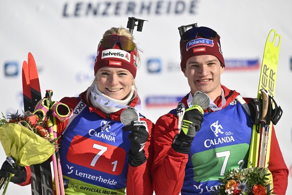 epa10438475 Silver medalistws Amy Baserga of Switzerland and Niklas Hartweg pose after the single mixed relay race at the IBU European Open Biathlon Championships, on Sunday, January 29, 2023, in Lenz ...