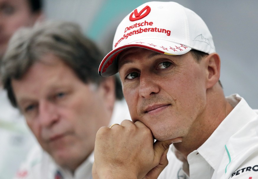 FILE - In this Thursday, Oct. 4, 2012 file photo, former Mercedes F1 driver Michael Schumacher of Germany attends a news conference to announce his retirement from Formula One at the end of 2012 in Su ...
