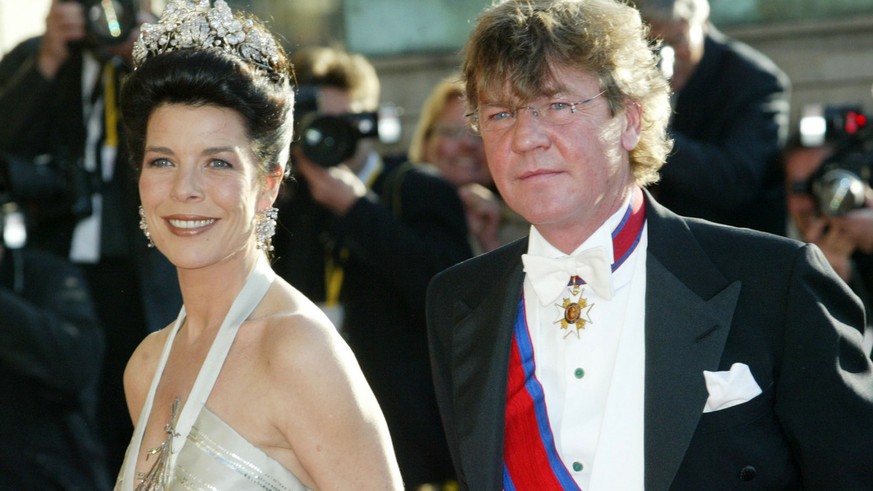 Monaco&#039;s Princess Caroline and Prince Ernst August of Hannover pass press photographers on their way to the Royal Theater in Copenhagen on Thursday, May 13, 2004. On the eve of the marriage of De ...