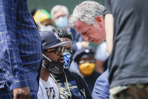 Terrence Floyd, brother of the deceased George Floyd, left, speaks with New York City Mayor Bill de Blasio during a rally at Cadman Plaza Park, Thursday, June 4, 2020, in the Brooklyn borough of New Y ...