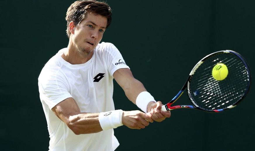 Britain&#039;s Aljaz Bedene returns a ball to Croatia&#039;s Ivo Karlovic during their Men&#039;s Singles Match on day one at the Wimbledon Tennis Championships in London Monday, July 3, 2017. (Gareth ...