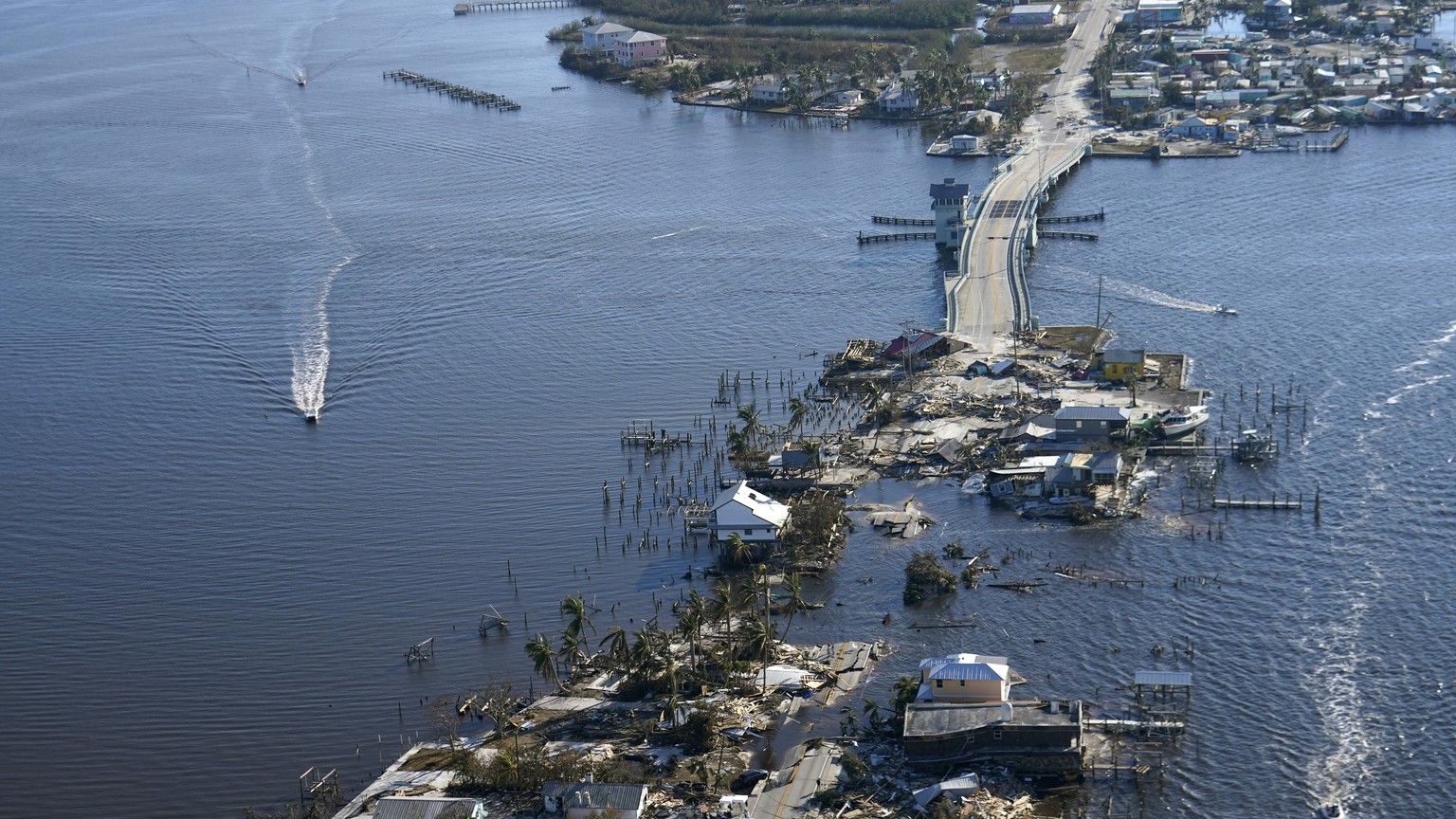 The bridge leading from Fort Myers to Pine Island, Fla., is heavily damaged in the aftermath of Hurricane Ian, Saturday, Oct. 1, 2022. Due to the damage, the island can only be reached by boat or air. ...