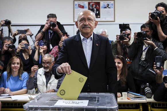 Turkey's main opposition Republican People's Party leader and Nation Alliance's presidential candidate Kemal Kilicdaroglu, front, casts his vote at a polling station in Ankara, Turkey, ...