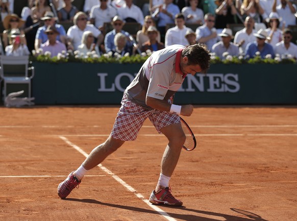 Switzerland&#039;s Stan Wawrinka reacts shortly before defeating Serbia&#039;s Novak Djokovic in their final match of the French Open tennis tournament at the Roland Garros stadium, Sunday, June 7, 20 ...