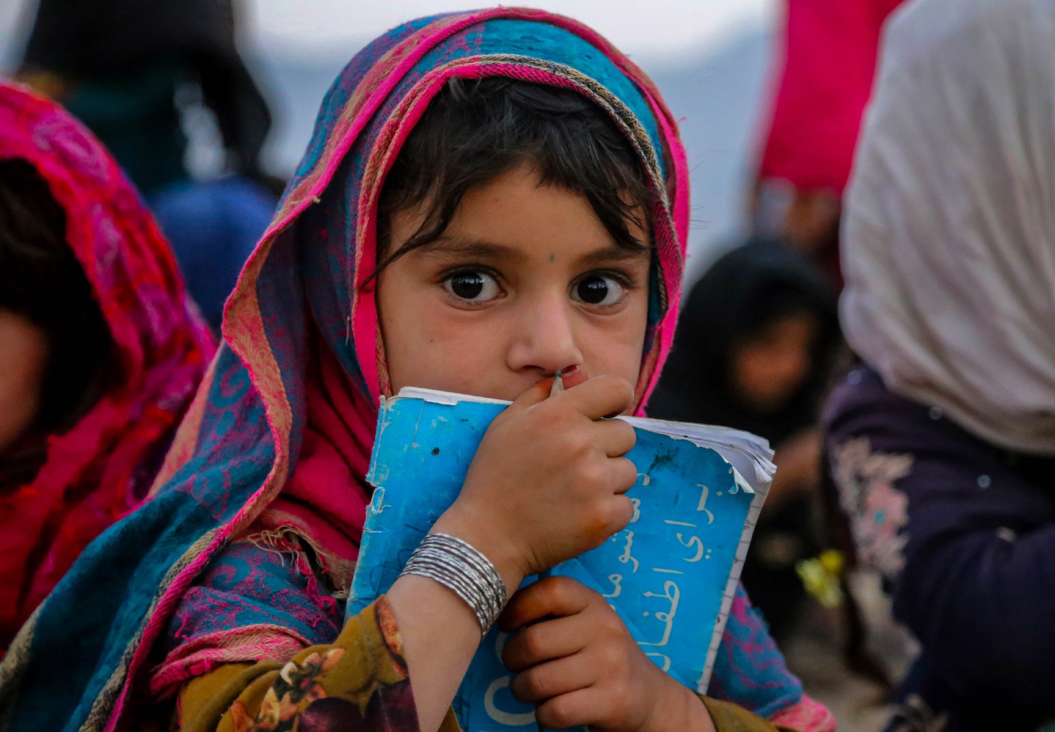 epa10901458 Afghan children attend a class at a mobile school voluntarily run by Afghan man Wazir Khan, on the outskirts of Kabul, Afghanistan, 04 October 2023 (issued 05 October 2023). Khan started & ...