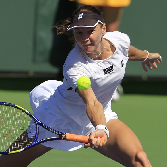 FILE - Renata Voracova of the Czech Republic returns a shot to Shuai Peng of China during a first round match at the BNP Paribas Open tennis tournament in Indian Wells, Calif., on March 10, 2011. The  ...