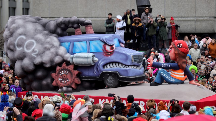 epa10479929 A carnival float titled &#039;Who is the climate terrorist here?&#039; parades during the annual Rose Monday (Rosenmontag) parade in Duesseldorf, Germany, 20 February 2023. Rose Monday is  ...