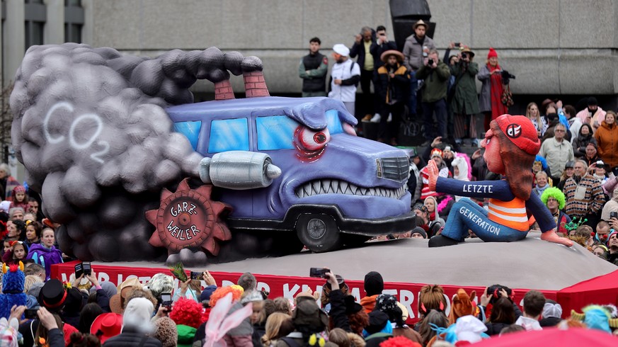 epa10479929 A carnival float titled 'Who is the climate terrorist here?' parades during the annual Rose Monday (Rosenmontag) parade in Duesseldorf, Germany, 20 February 2023. Rose Monday is ...