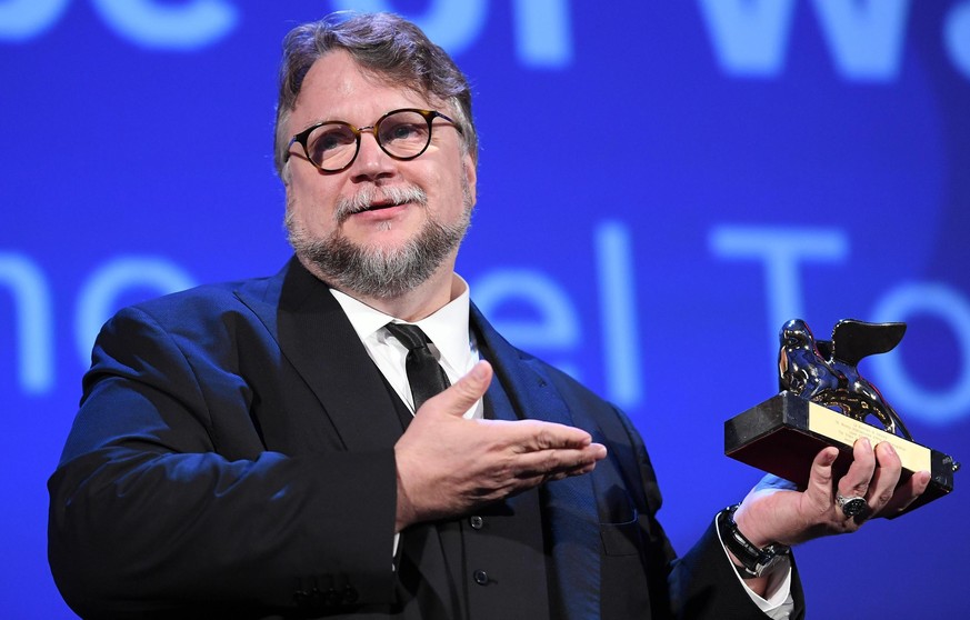 epa06194838 Mexican director Guillermo Del Toro holds the Golden Lion award he received for his movie 'The Shape of Water' during the awarding ceremony of the 74th annual Venice International Film Fes ...