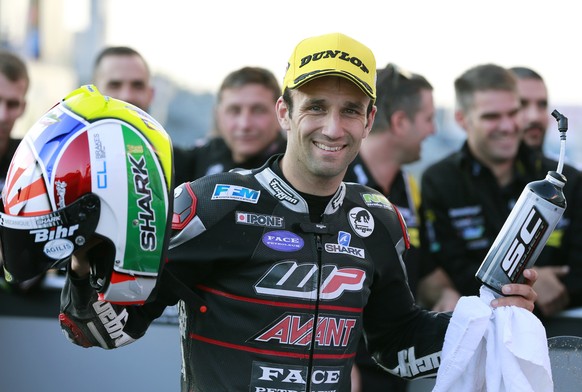 Moto2 driver Johann Zarco of France poses for a photo after taking pole position in the qualifying session for the MotoGP Japanese Motorcycle Grand Prix at the Twin Ring Motegi circuit in Motegi, nort ...