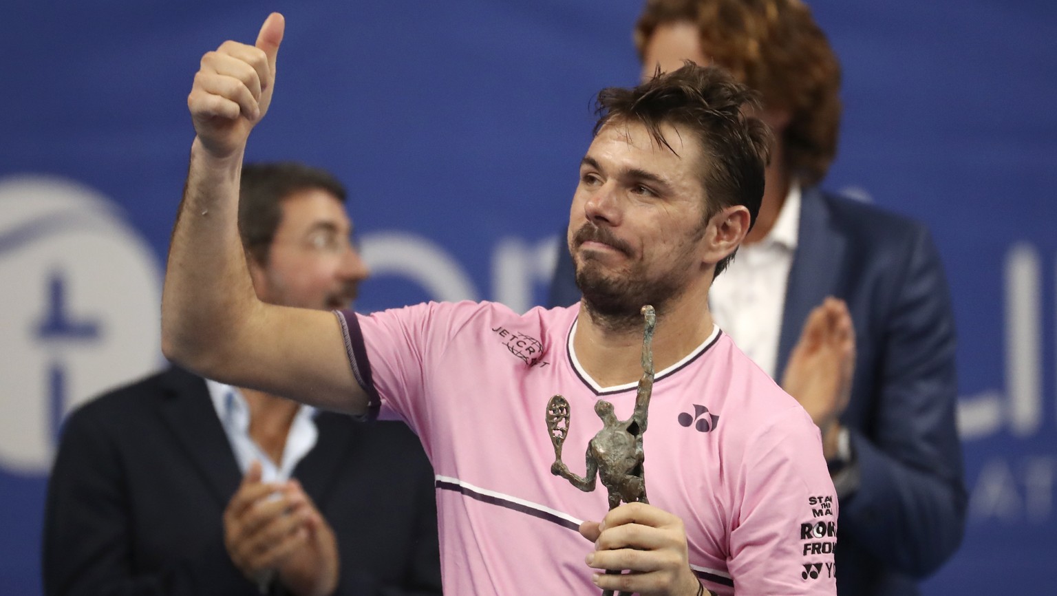 Stan Wawrinka of Switzerland gestures after receiving his second placed trophy at the European Open final tennis match in Antwerp, Belgium, Sunday, Oct. 20, 2019. Andy Murray of Britain defeated Wawri ...