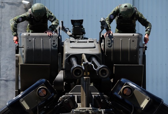Taiwanese soldiers operate a Oerlikon 35mm twin cannon anti-aircraft gun at a base in Taiwan&#039;s southeastern Hualien county on Thursday, Aug. 18, 2022. Taiwan is staging military exercises to show ...