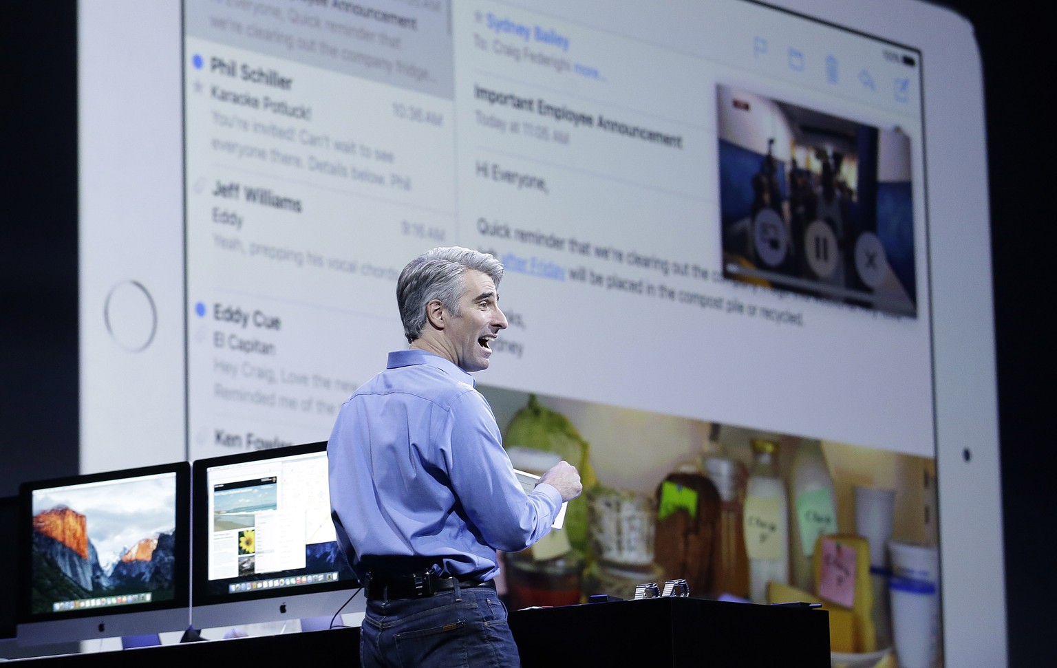 Craig Federighi, Apple senior vice president of Software Engineering, demonstrates the multitask feature on an iPad at the Apple Worldwide Developers Conference in San Francisco, Monday, June 8, 2015. ...