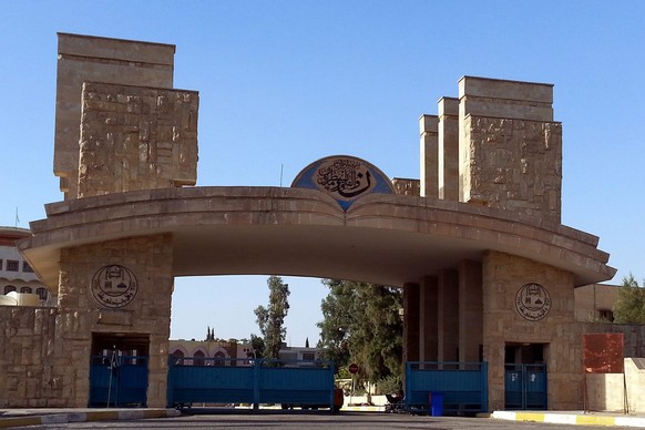 epa04312033 A picture made available on 12 July 2014 shows the gateway of Mosul University in Mosul city, northern Iraq, 10 July 2014. The International Atomic Energy Agency (IAEA) said on 10 July tha ...