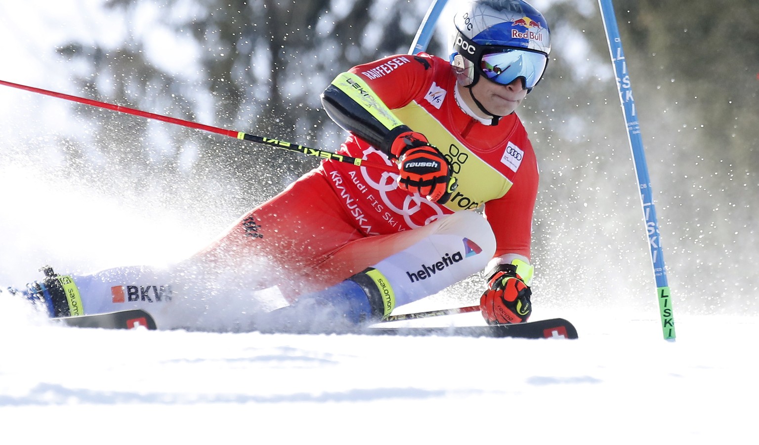 epa10516491 Marco Odermatt of Switzerland clears a gate during the first run of the Men&#039;s Giant Slalom of the FIS Alpine Skiing World Cup in Kranjska Gora, Slovenia, 12 March 2023. EPA/ANTONIO BA ...