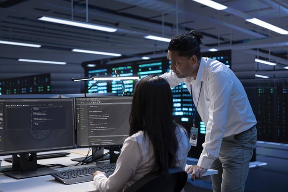 System administrators in data center running system diagnostic tests System administrators in data center running system diagnostic tests on PC to fix problems. IT experts deploying and error checking ...