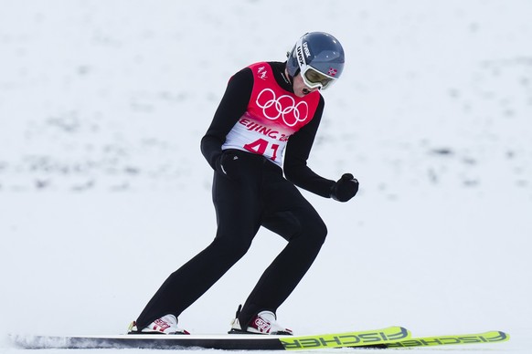 Jarl Magnus Riiber, of Norway, celebrates after his jump during the competition round of the individual Gundersen large hill/10km, ski jumping competition at the 2022 Winter Olympics, Tuesday, Feb. 15 ...