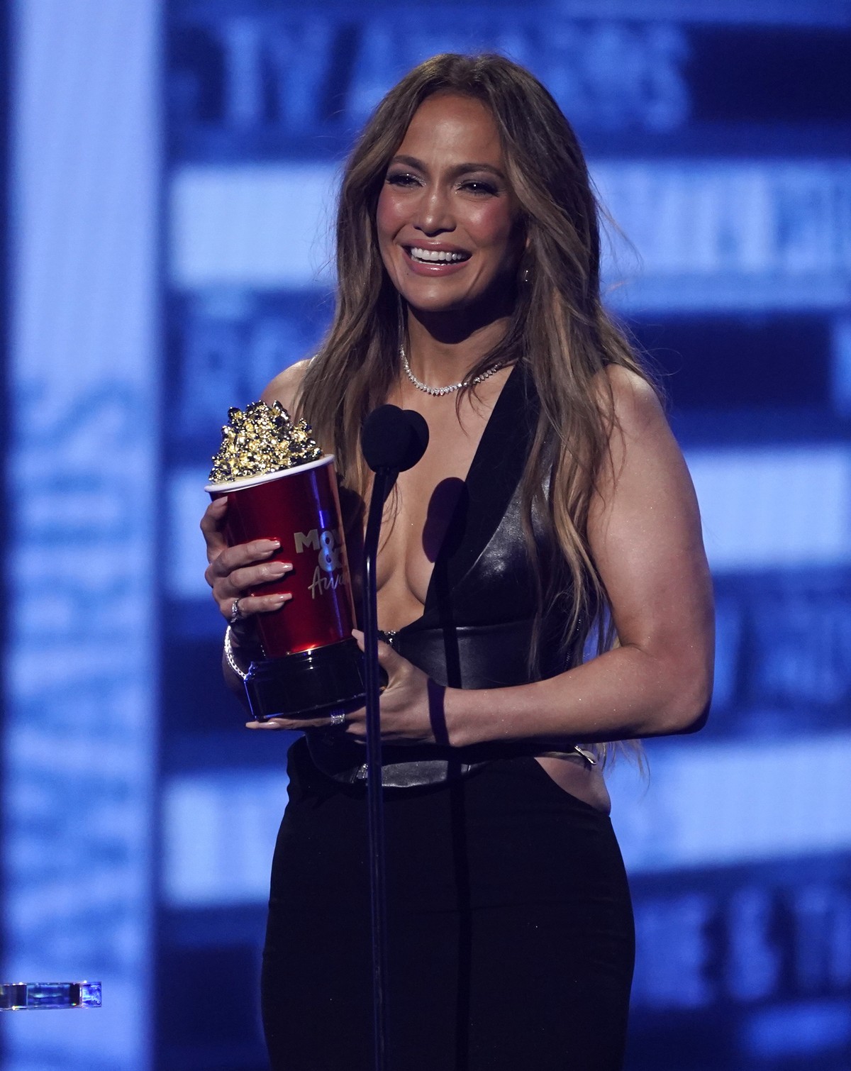 Jennifer Lopez accepts the award for best song for "On My Way (Marry Me)" at the MTV Movie and TV Awards on Sunday, June 5, 2022, at the Barker Hangar in Santa Monica, Calif. (AP Photo/Chris ...