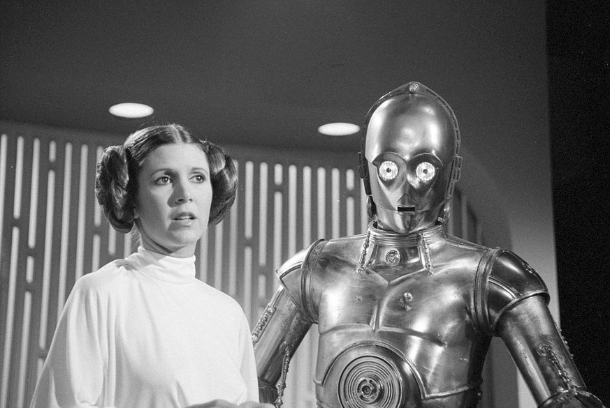 Carrie Fisher als Prinzessin Leia mit Anthony Daniels als C3PO in «Star Wars», 1977.