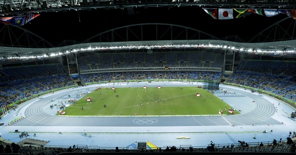 Empty seats inside the Olympic stadium during the athletics competitions of the 2016 Summer Olympics at the Olympic stadium in Rio de Janeiro, Brazil, Friday, Aug. 12, 2016. (AP Photo/Gregory Bull)