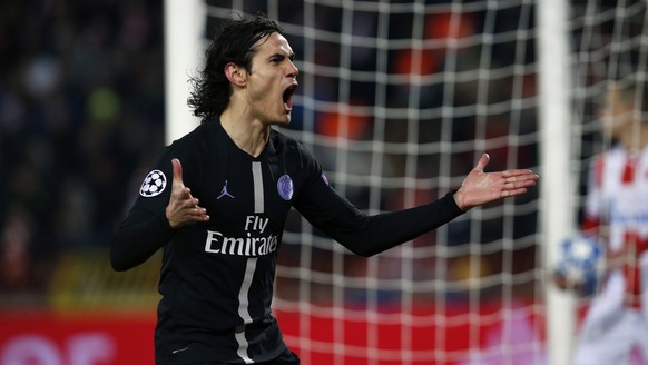 PSG forward Edinson Cavani celebrates after scoring the opening goal of the Champions League group C soccer match between Red Star and Paris Saint Germain, in Belgrade, Serbia, Tuesday, Dec. 11, 2018. ...