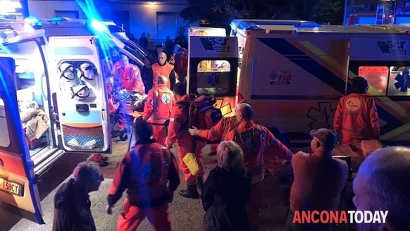 Rescuers assist injured people outside a nightclub in Corinaldo, central Italy, early Saturday, Dec. 8, 2018. At least six people, all but one of them minors, were killed and about 35 others injured i ...