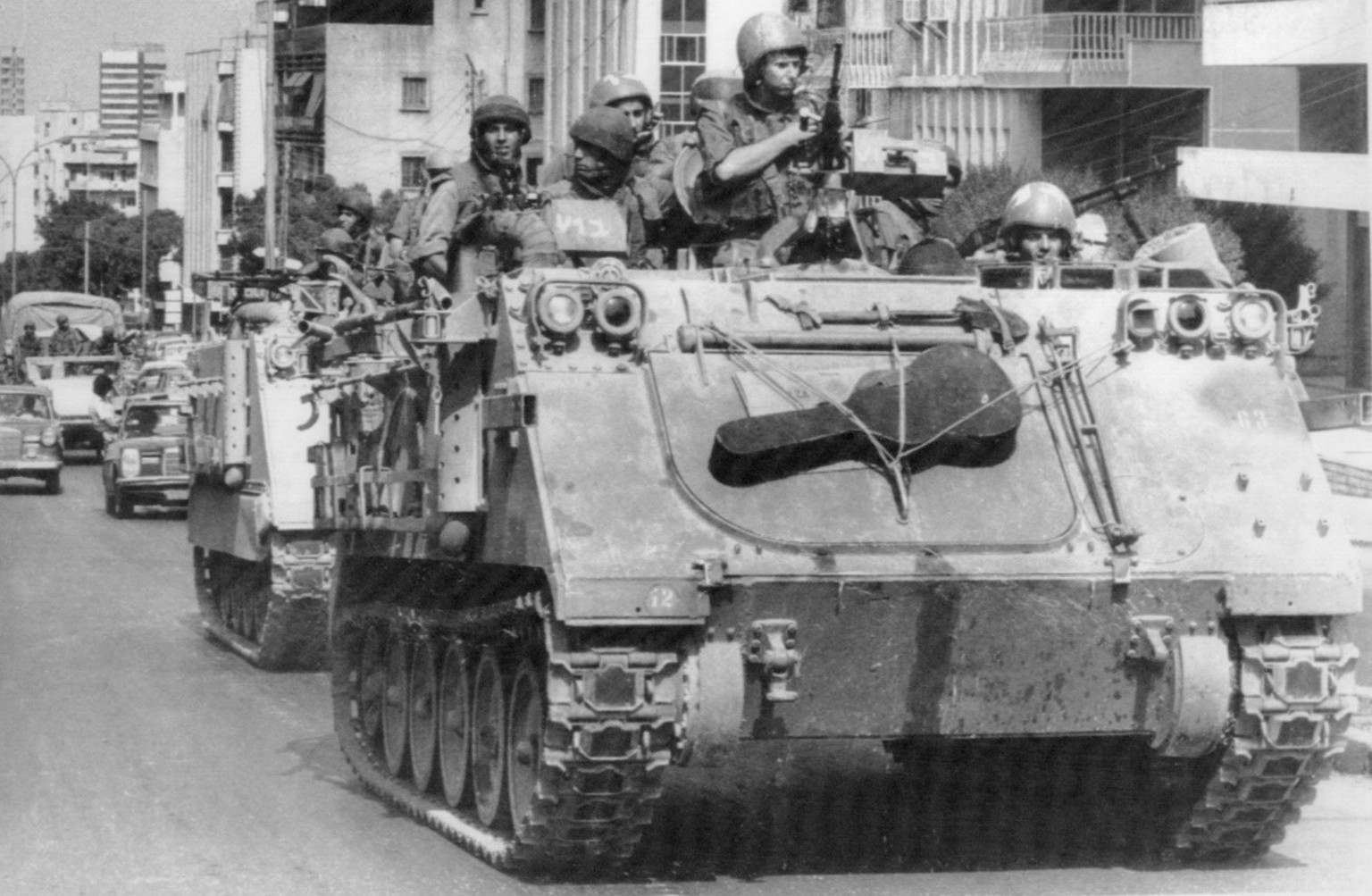 FILE - In this Sept. 28, 1982 file photo, Israeli tanks rumble through West Beirut streets, having just left the West Beirut port area. It was a century ago on Sept. 1, 1920, that a French general, He ...