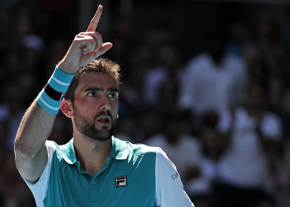 Croatia&#039;s Marin Cilic celebrates after defeating Portugal&#039;s Joao Sousa during their second round match at the Australian Open tennis championships in Melbourne, Australia, Wednesday, Jan. 17 ...