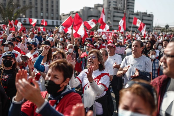 epa10289277 People march against the President of Peru, Pedro Castillo, in Lima, Peru, 05 November 2022. Thousands of demonstrators protested in Lima and other cities in Peru against the government of ...