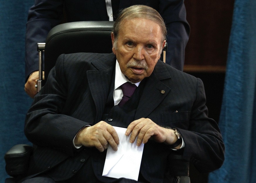 FILE - In this May 4, 2017 file photo, Algerian President Abdelaziz Bouteflika prepares to vote in Algiers. Algeria&#039;s powerful army chief said Tuesday March 26, 2019 that he wants to trigger the  ...