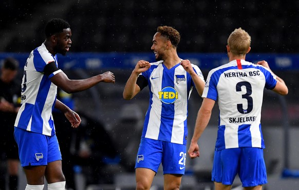 epa08438351 Matheus Santos Carneiro Da Cunha (C) of Hertha Berlin celebrates with teammates after scoring his team third goal during the German Bundesliga soccer match between Hertha BSC and 1. FC Uni ...