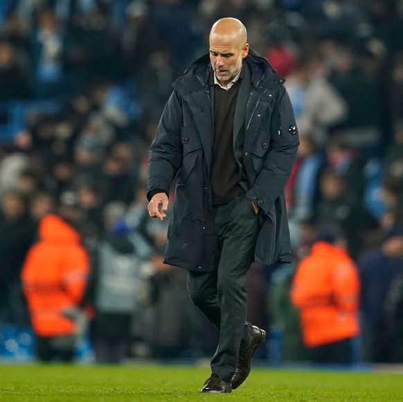 Manchester City&#039;s head coach Pep Guardiola walks on the pitch after the end of the Champions League opening phase soccer match between Manchester City and Bayer Leverkusen in Manchester, England, ...