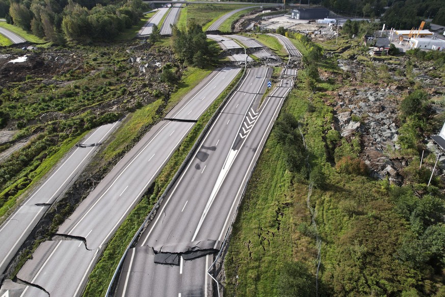 A view of the damage on the E6 near Stenungsund, Sweden, Sunday, Sept. 24, 2023. A landslide in western Sweden has caused a huge sinkhole on a major highway to Norway, and three people were injured wh ...