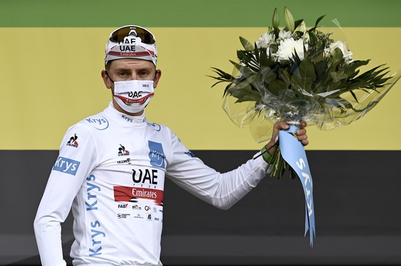 Slovenia&#039;s Tadej Pogacar, wearing the best young rider&#039;s white jersey, celebrates on the podium of the third stage of the Tour de France cycling race over 182.9 kilometers (113.65 miles) wit ...