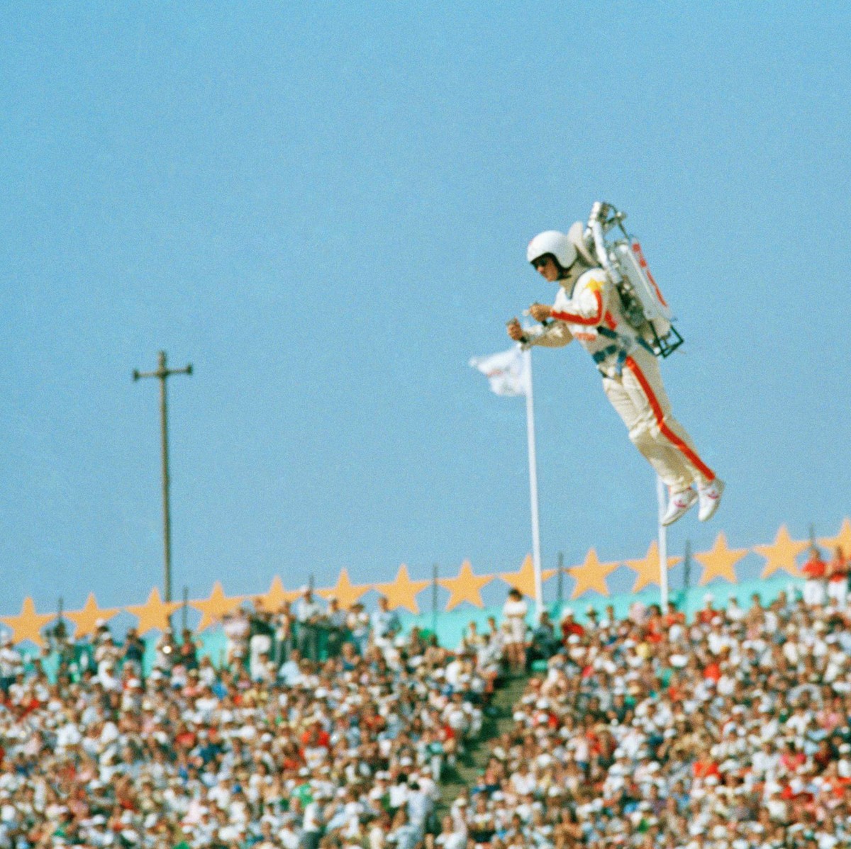 FILE - In this July 28, 1984 file photo Bill Suiter "Rocket Man" soars with the help of a jet pack during the welcoming of nations at the Opening ceremonies of the 1984 Summer Olympics in th ...