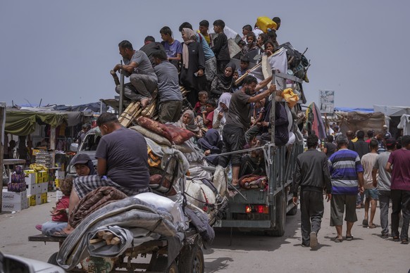 FILE - Palestinians fleeing from the southern Gaza city of Rafah during an Israeli ground and air offensive in the city on Tuesday, May 28, 2024. A single image, not even an authentic photograph, is t ...