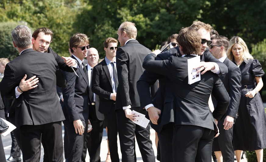 Players from the Columbus Blue Jackets and hockey players embrace after funeral for Columbus Blue Jackets hockey player John Gaudreau and brother Matthew Gaudreau at Saint Mary Magdalen Church in Medi ...