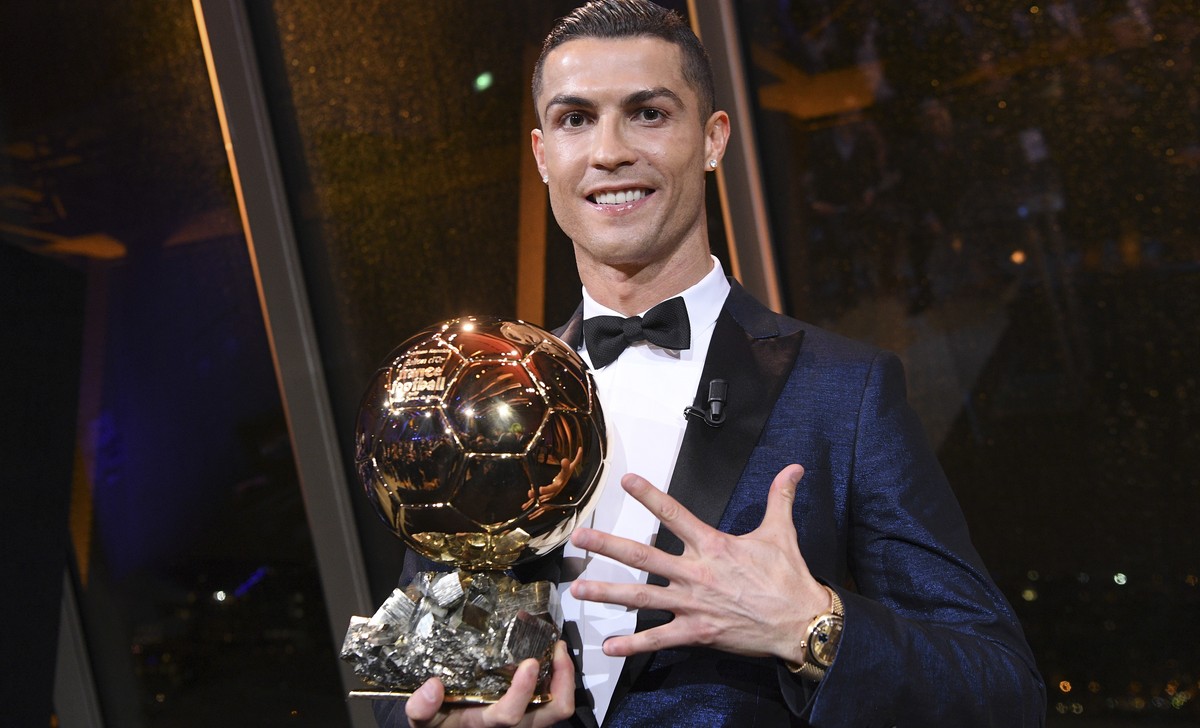 This image provided by L'Equipe Friday Dec.8, 2017 shows Portuguese soccer player Christiano Ronaldo holding the Ballon d' Or (Golden Ball) he received Thursday Dec.7, 2017 in Paris. A decad ...
