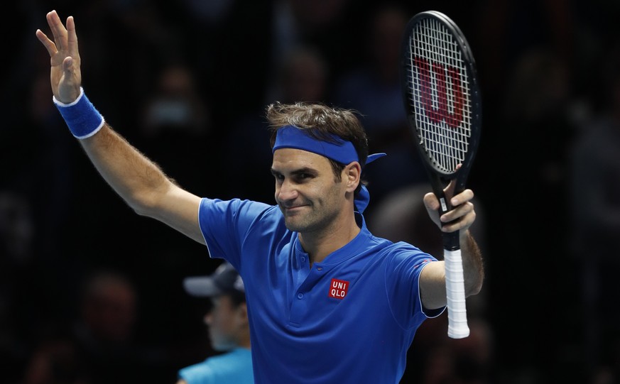 Roger Federer of Switzerland celebrates after defeating Dominic Thiem of Austria in their ATP World Tour Finals men&#039;s singles tennis match at the O2 arena in London, Tuesday, Nov. 13, 2018. (AP P ...