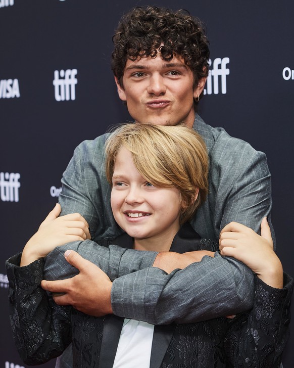 Actors Jacobi Jupe (bottom) and Noah Jupe are photographed on the red carpet for the film "Hamnet" during the Toronto International Film Festival in Toronto, on Sunday, Sept. 7, 2025. (Sammy ...
