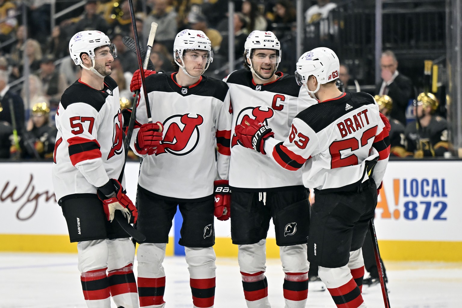 The New Jersey Devils celebrate center Nico Hischier&#039;s (13) goal during the third period of an NHL hockey game against the Vegas Golden Knights Sunday, March 17, 2024, in Las Vegas. (AP Photo/Dav ...