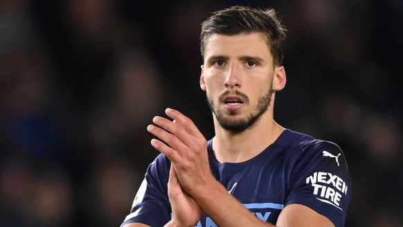 epa09541952 Manchester City's Ruben Dias applauds fans after the English Premier League soccer match between Brighton Hove Albion and Manchester City in Brighton, Britain, 23 October 2021. EPA/FA ...