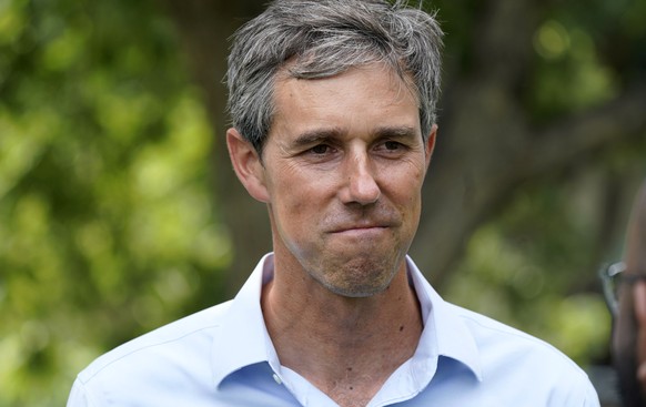 FILE - Democrat Beto O&#039;Rourke listens to a volunteer before a Texas Organizing Project neighborhood walk in West Dallas in this June 9, 2021 file photo. O