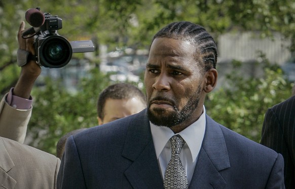 FILE - R. Kelly arrives for the first day of jury selection in his child pornography trial at the Cook County Criminal Courthouse in Chicago, May 9, 2008. (AP Photo/Charles Rex Arbogast, File)
R. Kell ...