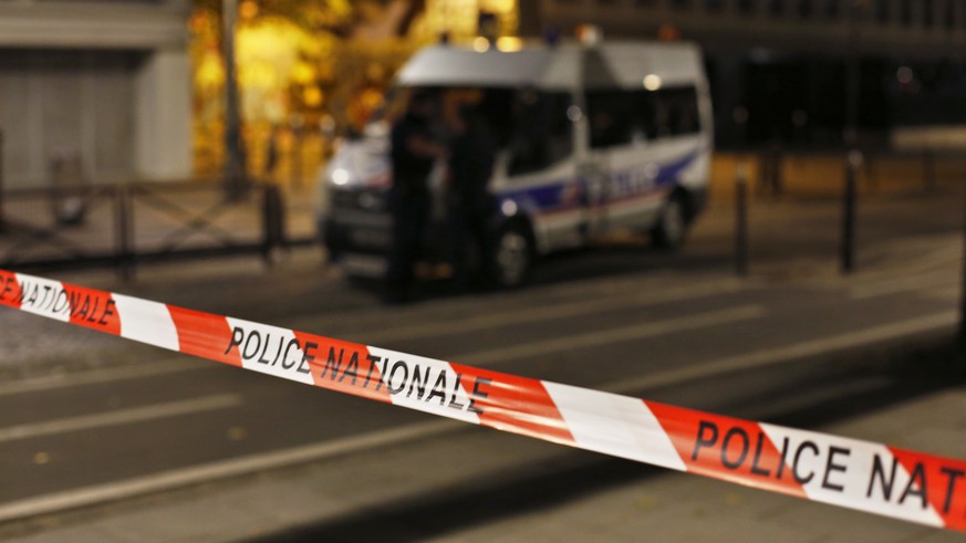 Police secures the site of a knife attack in Paris, Monday, Sept. 10, 2018. A several people were injured in a knife attack in central Paris late Sunday but police said that terrorism was not suspecte ...
